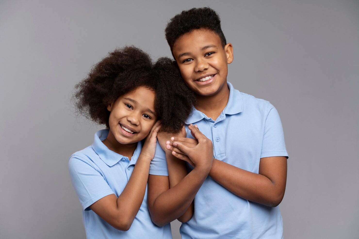 cute-siblings-posing-together_23-2149352378